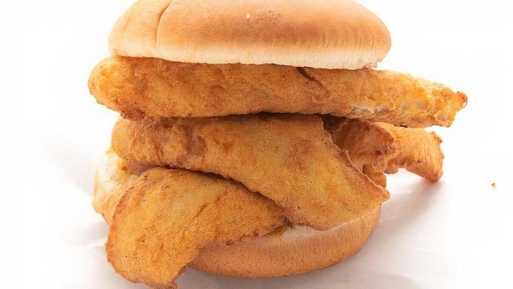 Kids Whiting Sandwich · A kids sized portion of whiting on a small bun, one side and a small drink.