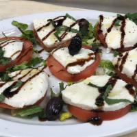 Greek Salad · Lettuce, tomato, red onion, cucumbers, banana peppers, feta cheese, kalamata olive, and crou...