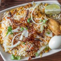 Master Chicken Biryani · Chicken marinated with herbs, Indian spices and cooked with long grain basmati rice served w...