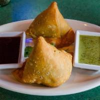 Samosa · Two pieces and deep fried savory pastry stuffed with vegetables.