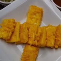 Paneer Pakora · Homemade Indian cheese fried with gram flour, herbs and spices.