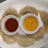 Chicken Mo:Mo Classic · Steamed dumplings stuffed with finely chopped veggies, ground chicken, special herbs and spi...