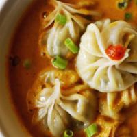 Veg Mo:Mo Soup/Jhol · Vegetarian. Steamed dumplings stuffed with finely chopped veggies, cottage cheese,special he...