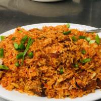 Goat Briyani · Spicy. Goat cooked with basmati rice, ghee, aromatic herbs and exotic spices