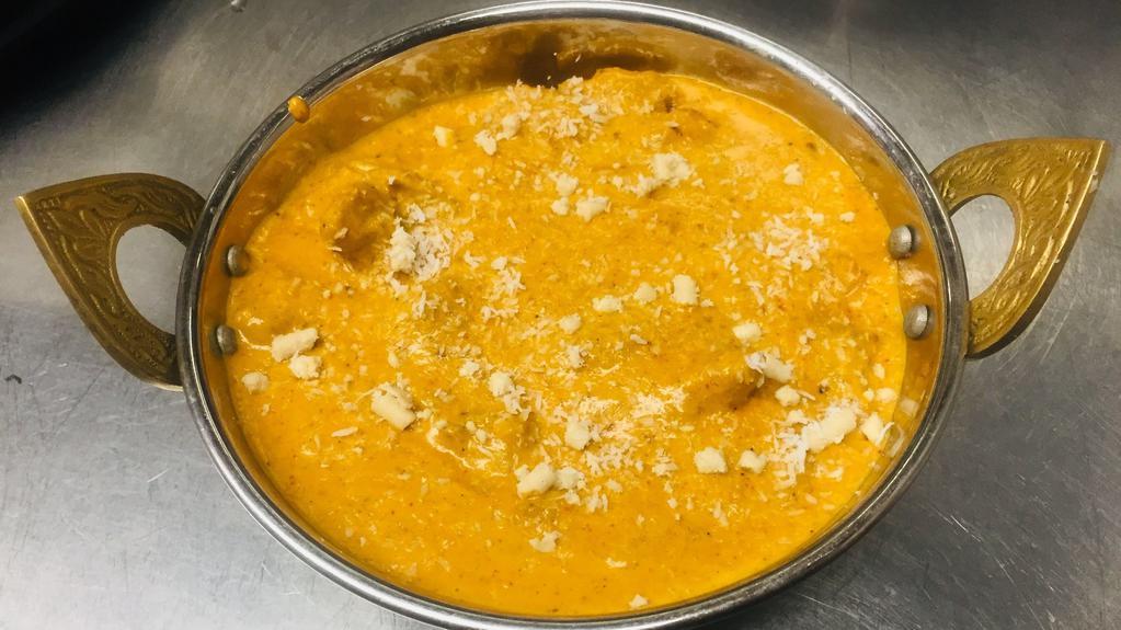 Chicken Korma · Gluten free.  Chicken with cashew nuts, shredded coconut and cream simmered to perfection with herbs and spices.