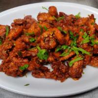 Chicken 65 · Marinated Fried Chicken sauteed with generous amount of garlic and herbs