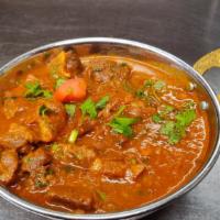 Goat Curry · Gluten free. Goat meat with bone, traditional dish of Nepal, carefully seasoned with the exo...