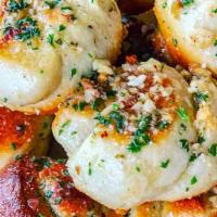 Garlic Knots · Customer favorite! Offered in orders of six these delights are oven baked pizza dough knots ...