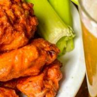 7 Jumbo Wings · 7 jumbo wings that are juicy and fall of the bone served with bleu cheese or ranch dressing ...