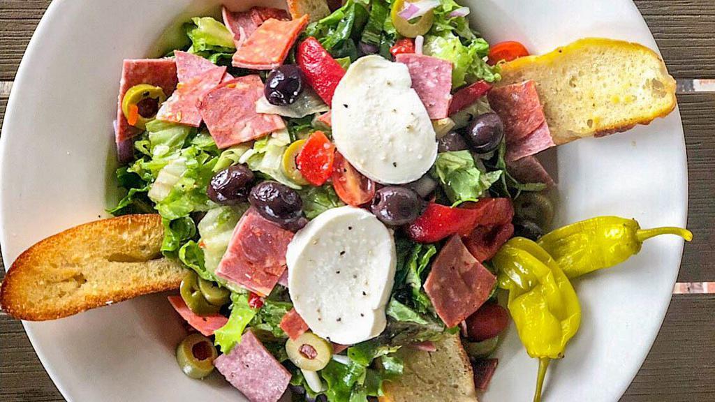 Antipasto Salad · Mixed greens, roasted red peppers, red onions, diced pepperoni, Genoa salami, grape tomatoes, cappicola ham, fresh mozzarella and kalamata olives. Tossed in our homemade Italian dressing and served with a garlic crostini.