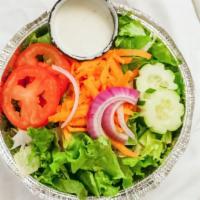Side Salad · Mixed greens served with Roma tomatoes, carrots, red onions and cucumbers.