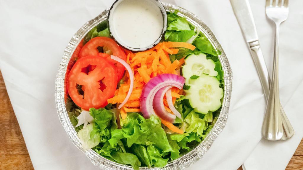 Side Salad · Mixed greens served with Roma tomatoes, carrots, red onions and cucumbers.