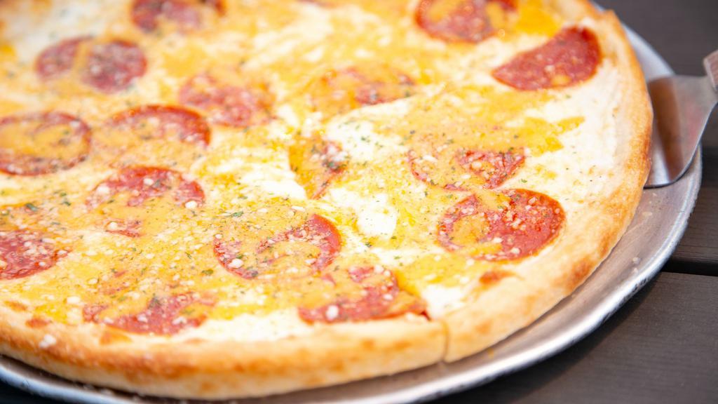 Classic White 4 Cheese Pepperoni Pizza · Ricotta cream sauce base topped with Mozzarella cheese, Cheddar cheese, Parmesan cheese, and pepperoni.
