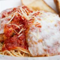 Chicken Parmesan · Hand breaded chicken topped with melted mozzarella cheese over a bed of angel hair in marina...