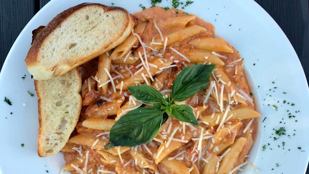 Penne Ala Vodka · Penne pasta sautéed with prosciutto and diced shallots finished in a vodka cream sauce.