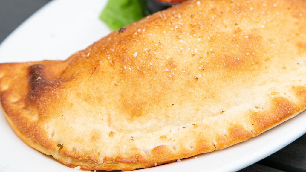 Fresh Calzones · Gently baked pizza dough pockets filled with ricotta and mozzarella cheeses served with a side of marinara sauce.
Max 2 toppings.