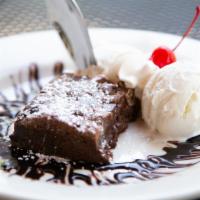 Brownie Ala Mode · Moist chocolate brownie, served with vanilla ice cream.