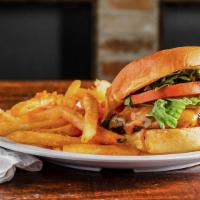 Flambo Burger · Flambo patty, American cheese, lettuce, tomato, pickles, remoulade, on a potato bun with sea...