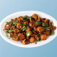 Chilli Mushroom Ching'S · Fresh mushrooms marinated with ginger, garlic, chilies, batter fried and wok tossed with Ind...