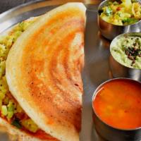 Masala Dosa · Crepe made with Rice. Stuffed with Potato Filing and  Served with Chutney and Sambar (Lentil...