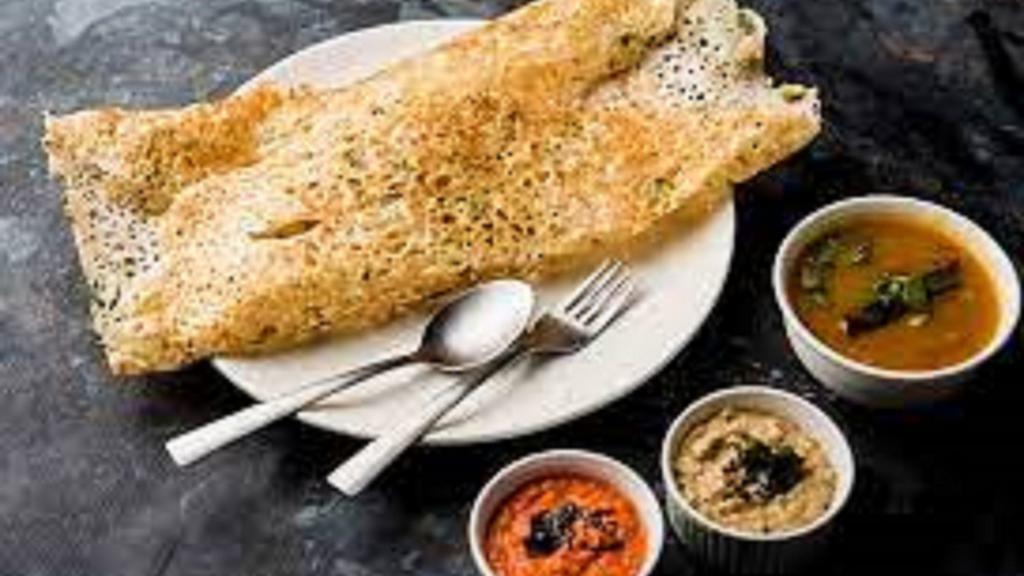 Masala Rava Dosa · A Thin and Crispy Crepe made with Semolina and Rice flour. Stuffed with Potato Filling. Served with Chutney and Sambar(Lentil Soup)