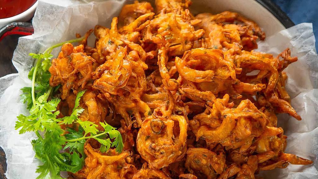 Onion Pakoda · Vegetarian. A Delicious Indian Crisp fried Snack made with Gram Flour, Spices and onion.