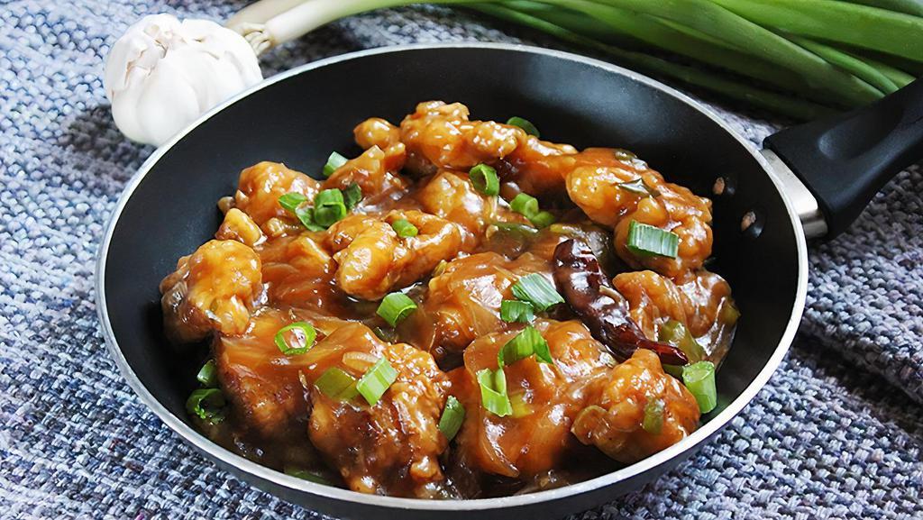Chicken Manchurian · A Traditional Indo-Chinese dish made with Fried Chicken Dices cooked in a spicy sauce.