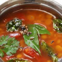 Rasam · South Indian spiced soup made with tamarind, tomatoes, spices and herbs.