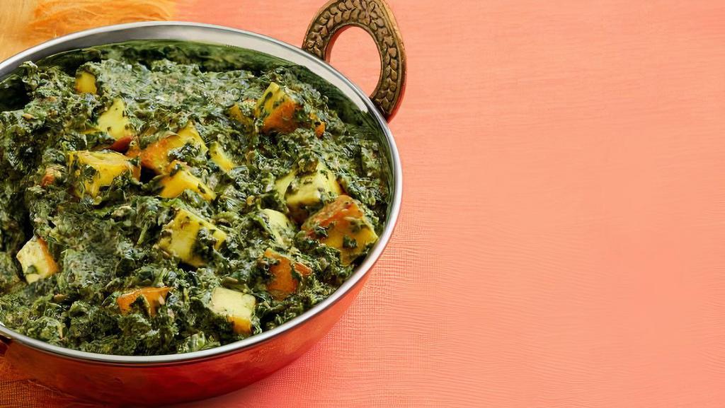 Saag/Palak Paneer · Cottage Cheese cubes cooked in a Creamy Buttery Spinach Puree.