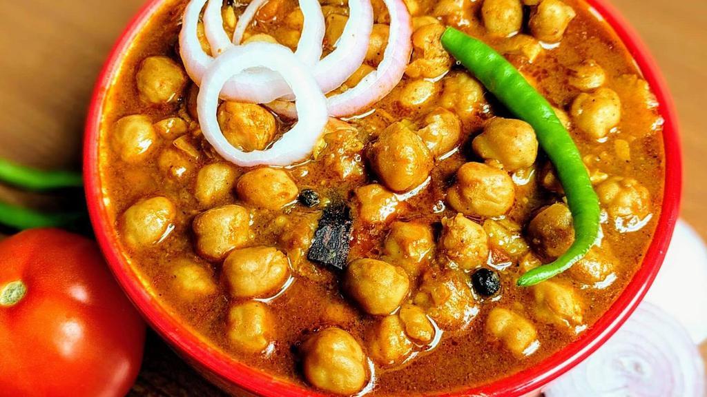 Channa Masala · A Delicious & Flavorful Indian Curry made with Chickpeas in a spicy onion tomato masala gravy.