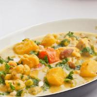 Veg Korma · This mixed vegetable curry is packed with veggies like carrot, peas, potatoes, tomatoes and ...