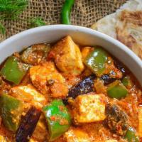 Kadai Paneer · Cottage cheese cubes and bell peppers cooked in onion gravy with freshly grounded spices.