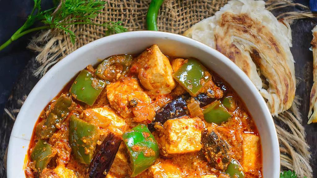 Kadai Paneer · Cottage cheese cubes and bell peppers cooked in onion gravy with freshly grounded spices.