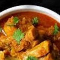 Andhra Chicken Curry · It is a Home Style Bone-In Chicken Curry cooked in Freshly grounded Masalas.