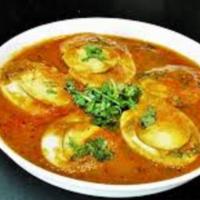 Egg Masala · Popular Side Dish made with Boiled Eggs cooked in onion tomato gravy.