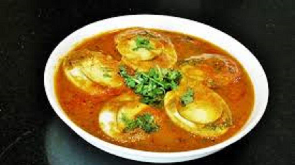 Egg Masala · Popular Side Dish made with Boiled Eggs cooked in onion tomato gravy.