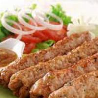 Chicken Seekh Kebab · Seekh kebabs made from grounded chicken meat, masalas and seasoning, put on a skewer and gri...