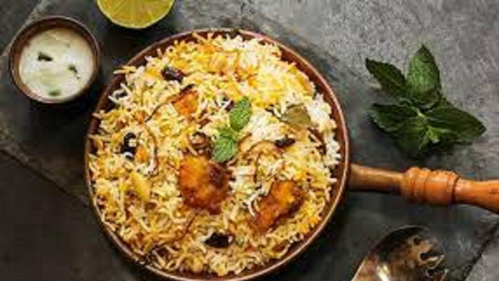 Hyd Chicken Dum · a popular spice and Chicken flavored rice dish which is typically prepared by layering the biryani masalas and basmati rice along with chicken in flat bottom vessel and cooking on slow heat