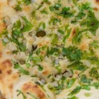 Garlic Naan · Vegetarian. Naan topped with fresh garlic and cilantro.