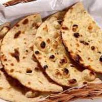 Tandoori Roti · Vegetarian. Stoned whole wheat bread cooked on clay oven.