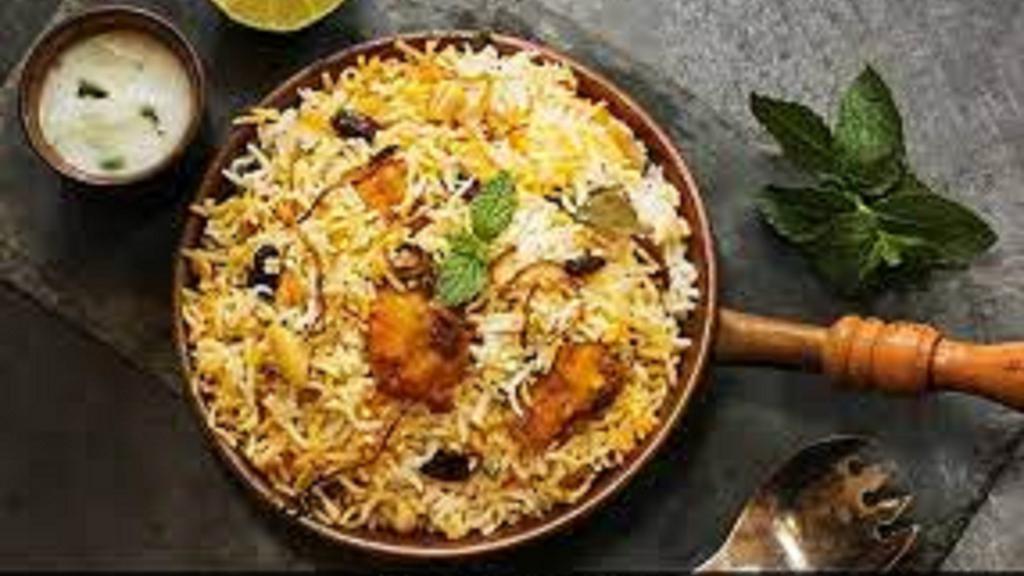 Chicken Dum Biryani Family Pack · a popular spice and Chicken flavored rice dish which is typically prepared by layering the biryani masalas and basmati rice along with chicken in flat bottom vessel and cooking on slow heat