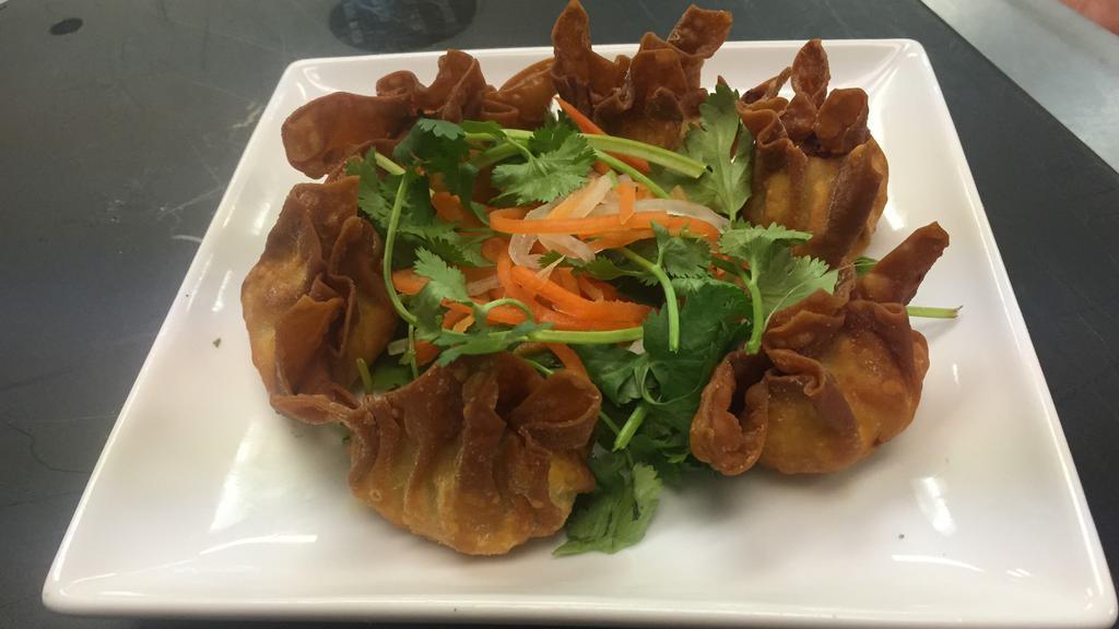 Golden Fried Wontons · (6) Fried Wontons filled with shrimp and pork. Served with a sweet chili sauce.
