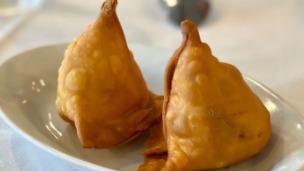 Vegetable Samosa · Deep-fried flaky pastry, stuffed with potatoes, onions, And traditional spices. Includes 2 s...