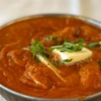 Butter Chicken · Boneless chicken cooked in a cream curry sauce. Served with rice.
