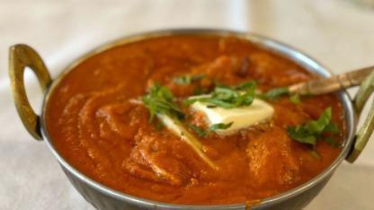 Butter Chicken · Boneless chicken cooked in a cream curry sauce. Served with rice.