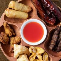 Pu Pu Platter (For 2) · Two of each- vegetable roll, bbq ribs, beef skewer, chicken wing, crab rangoon, and jumbo sh...