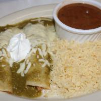 Green Enchiladas (2) · Shredded chicken, tomatillo sauce, white cheese, and sour cream on top
