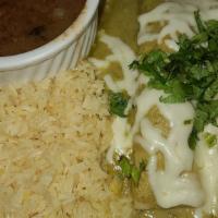 Enchiladas De Cilantro (2) · Shredded chicken, cilantro sauce, white cheese and sour cream on top.