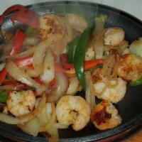 Camarones A La Plancha · Shrimp, onions, bell pepper on the grill, rice, and beans.