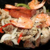 Parrillada Mix · Beef, chicken, shrimp, green pepper, red pepper, onions, charros beans and rice.